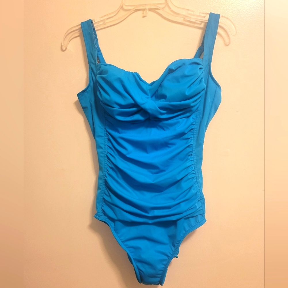 Blue one piece. Great slimming bathing suit. Made by trimshaper. Size L